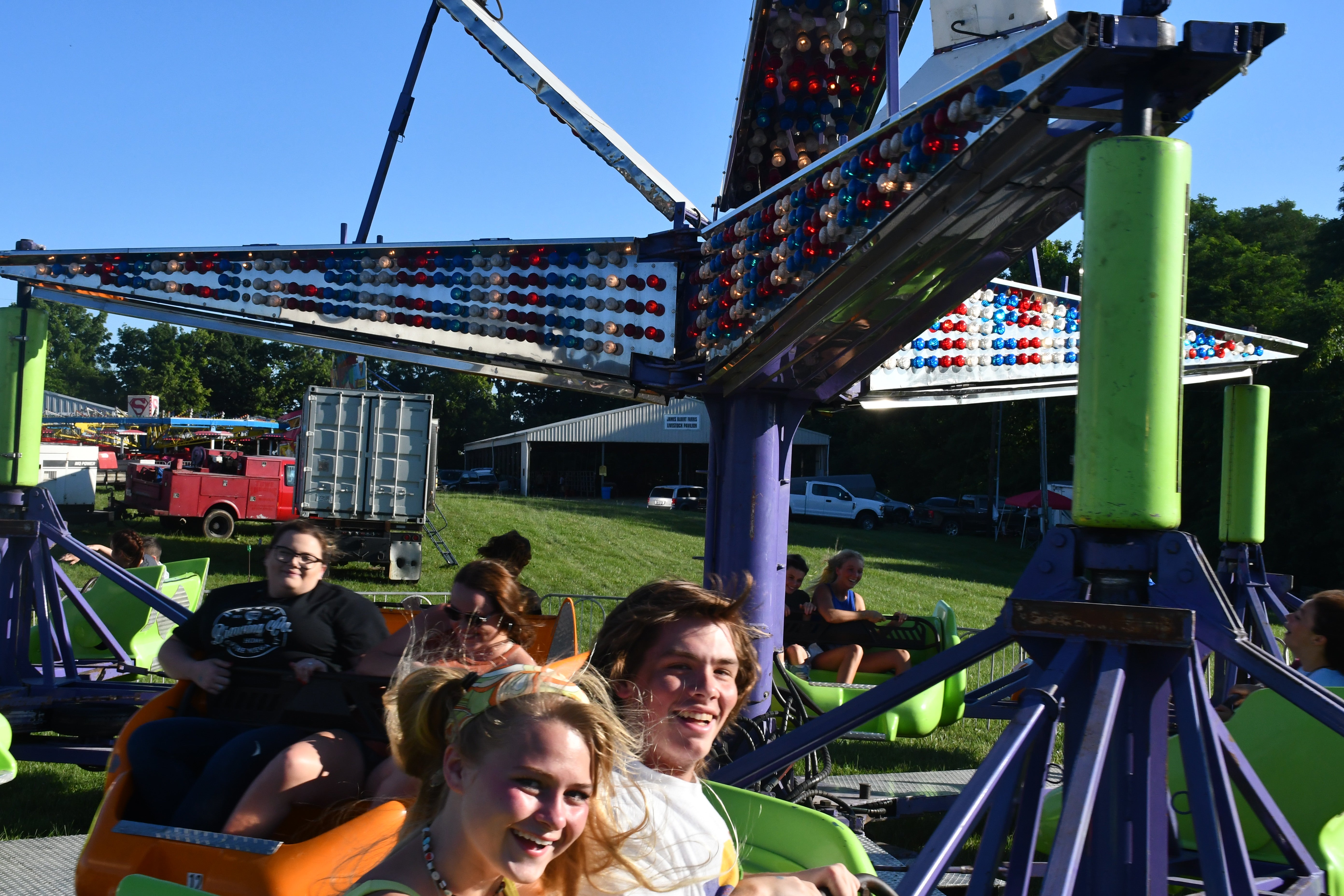 Cassada Herman (L) and Jack James (R) enjoy a spin onboard the Space Sled at the Clark County Fair.